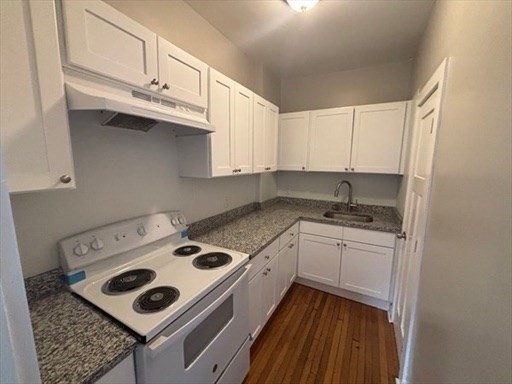 772 Rock Street Fall River, MA 02720 - Photo 9 of 17 a kitchen with appliances cabinets and a counter top space