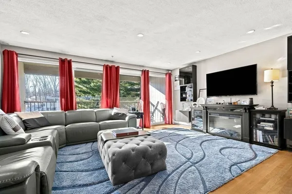 a living room with lots of furniture and window