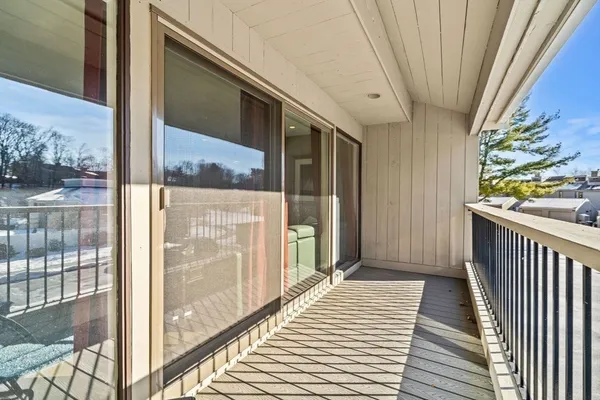 a view of balcony with wooden floor