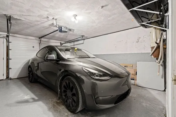 a view of parking garage with cars