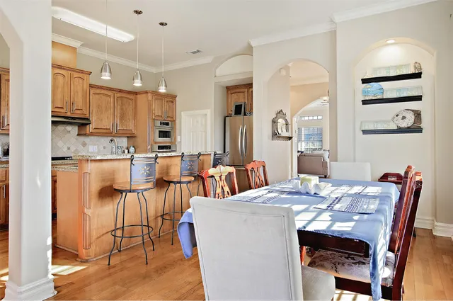 a view of kitchen with cabinets and wooden floor