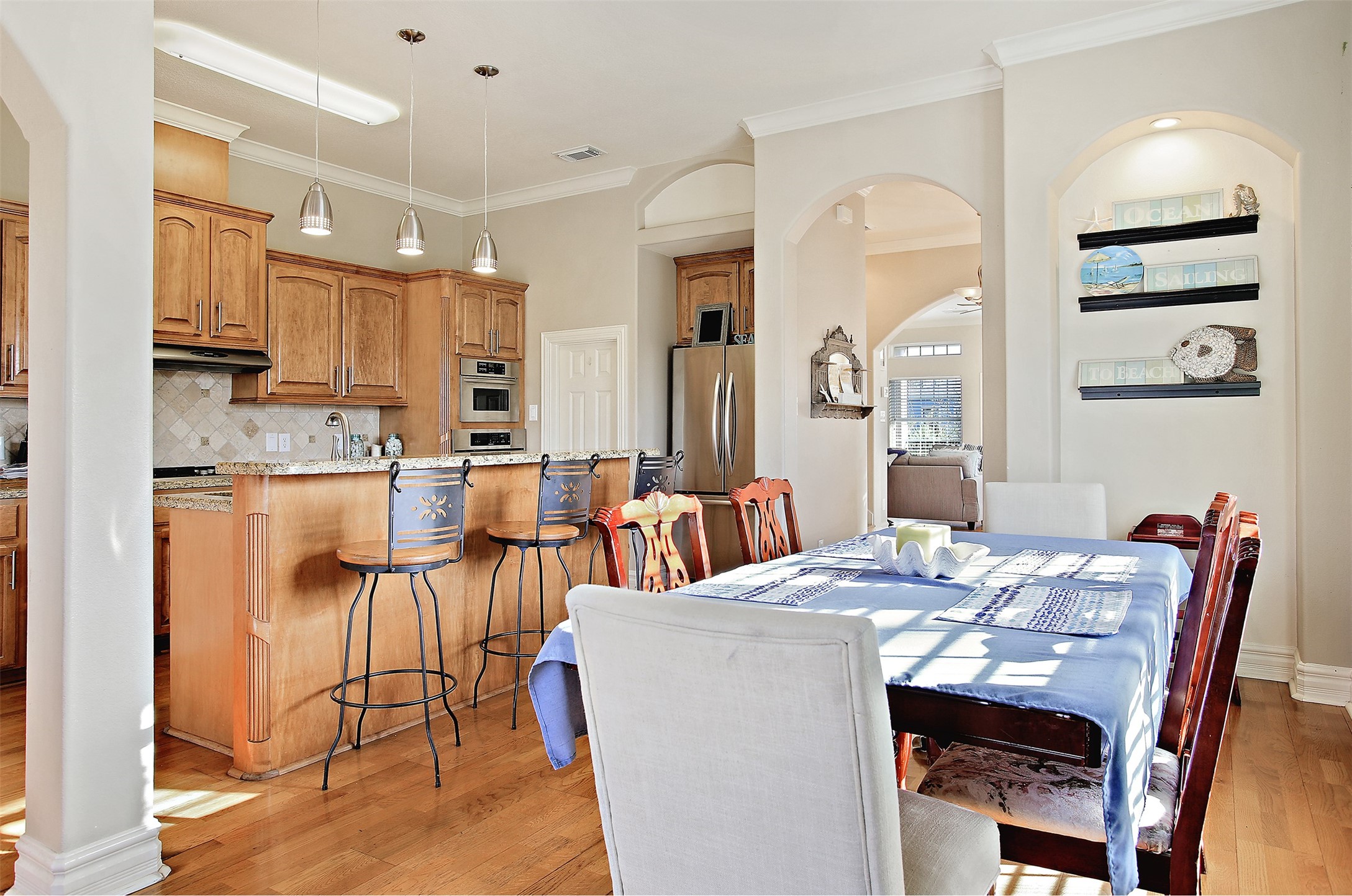 612 8th Street Kemah, TX 77565 - Photo 11 of 20 a view of kitchen with cabinets and wooden floor