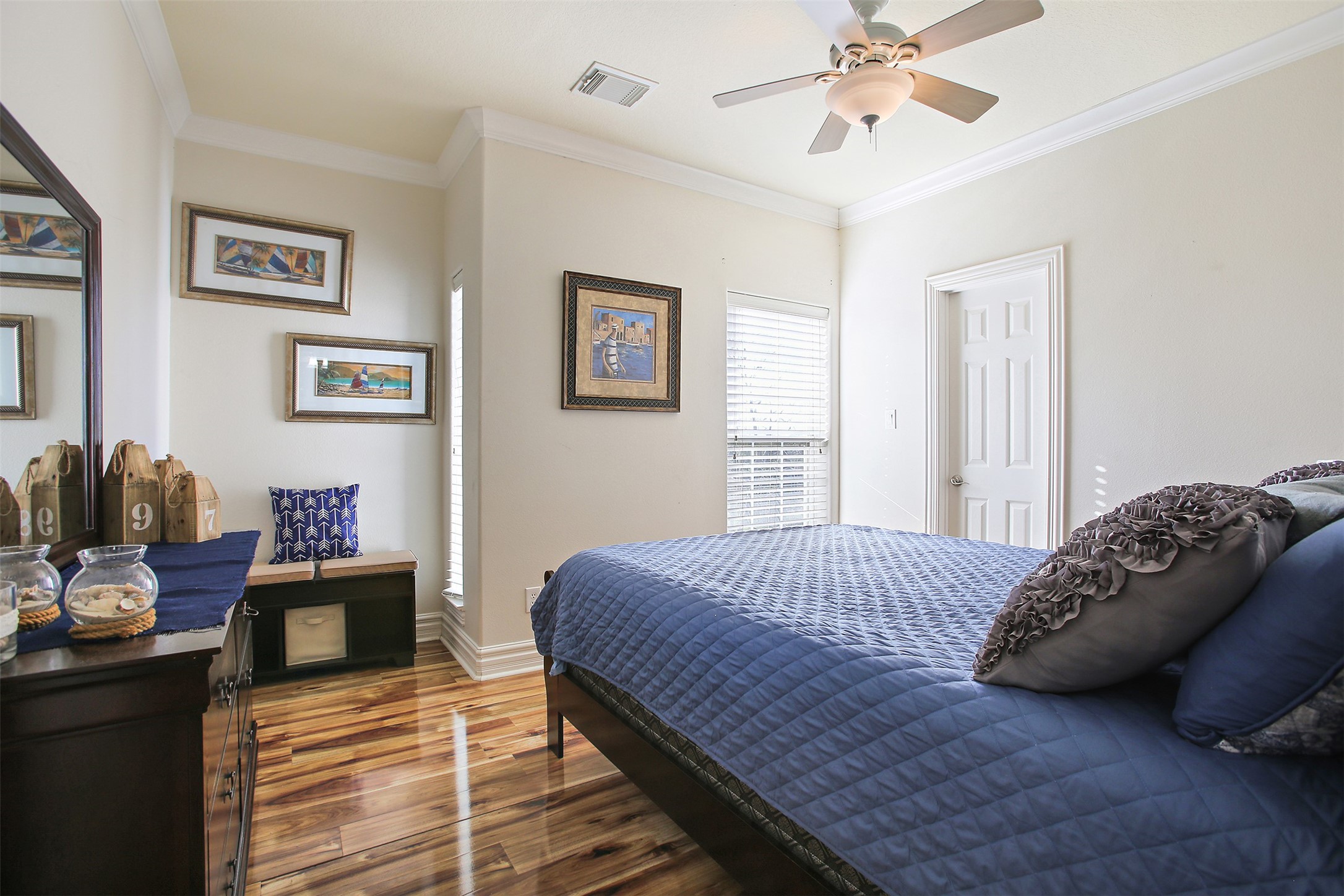 612 8th Street Kemah, TX 77565 - Photo 15 of 20 a bedroom with a bed and wooden floor