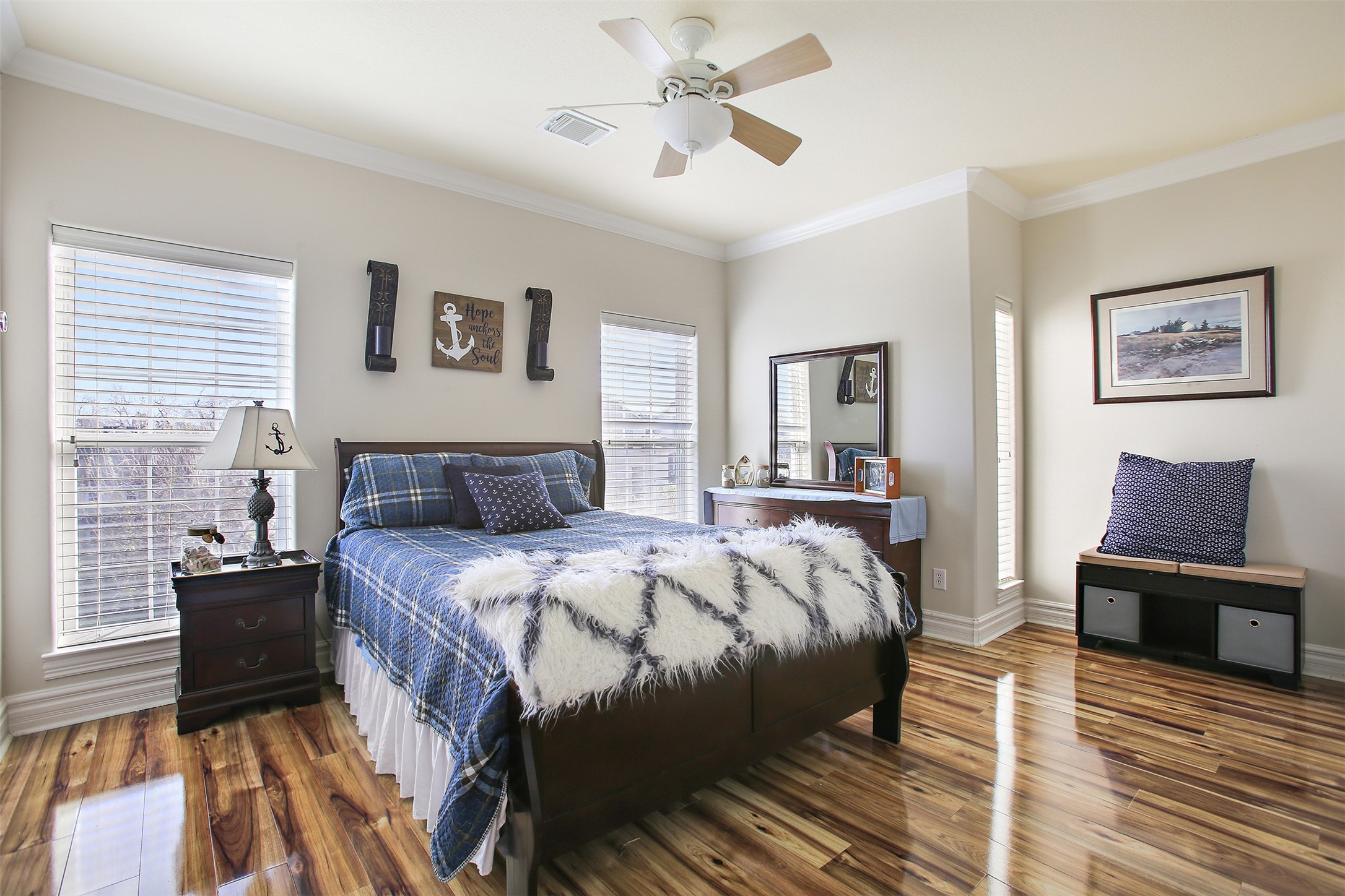 612 8th Street Kemah, TX 77565 - Photo 16 of 20 a bed room with a bed and a chandelier