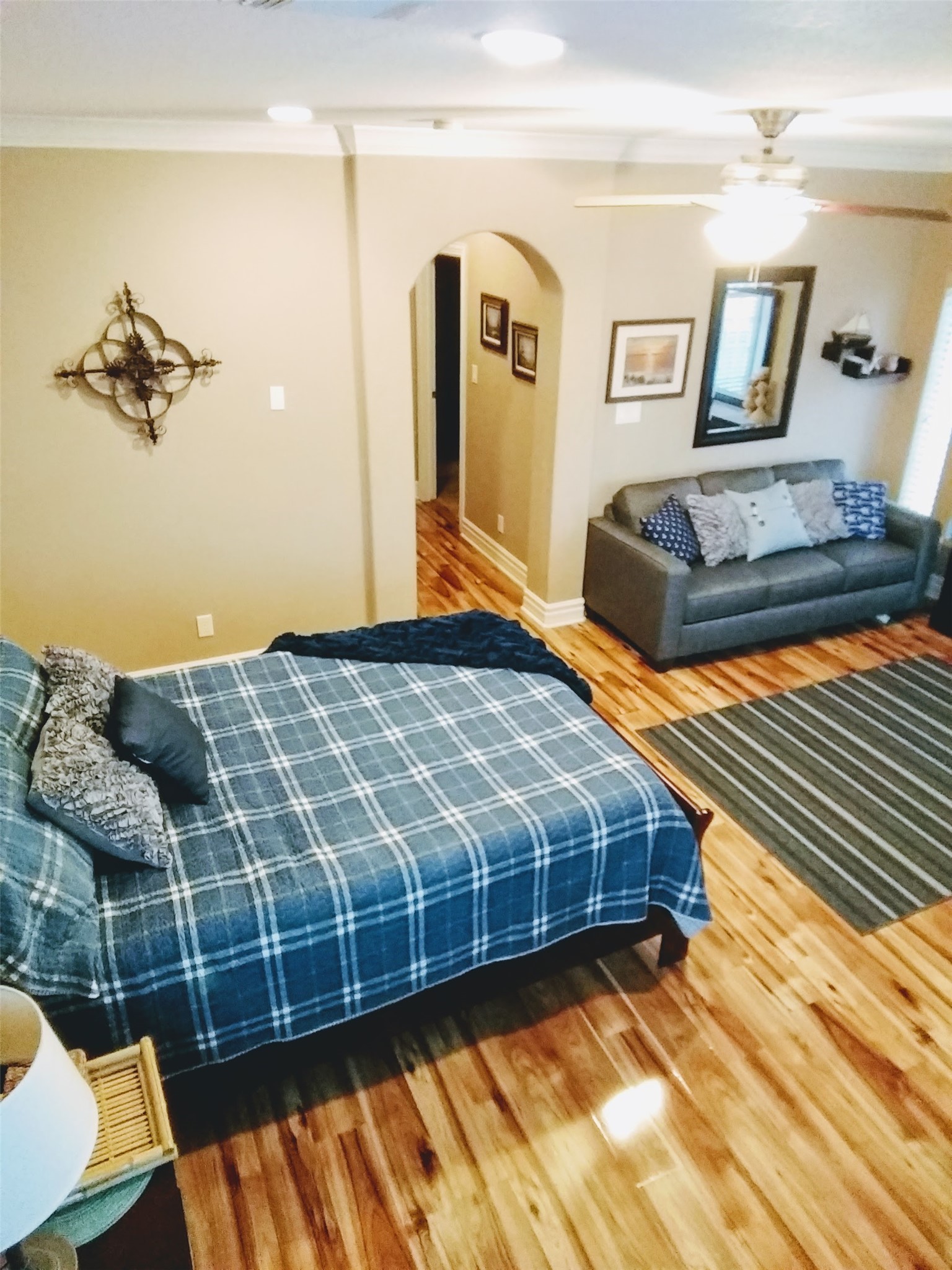 612 8th Street Kemah, TX 77565 - Photo 18 of 20 a bedroom with a bed and wooden floor