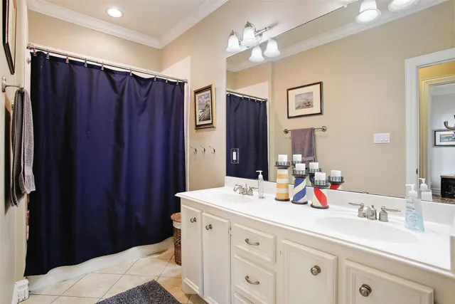 a bathroom with a double vanity sink and a mirror