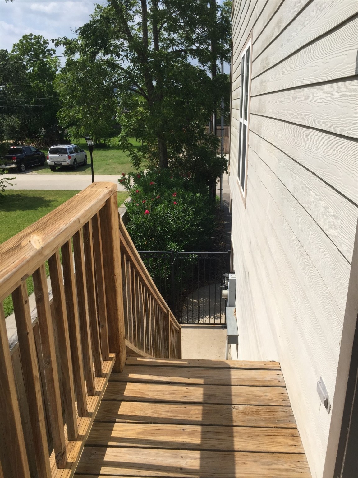 612 8th Street Kemah, TX 77565 - Photo 6 of 20 a view of balcony with wooden floor and fence