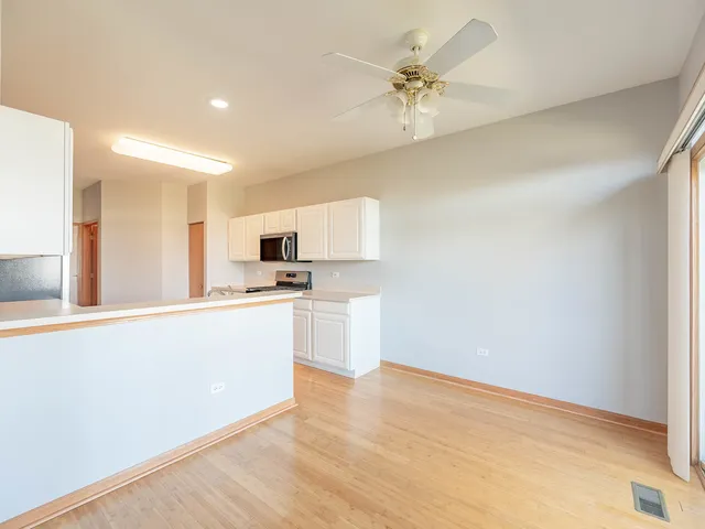 a view of a kitchen with a sink and a stove top oven