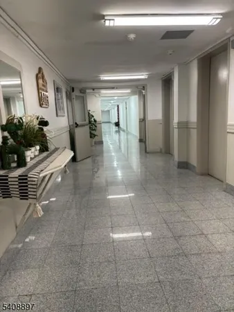 a lobby with furniture and window