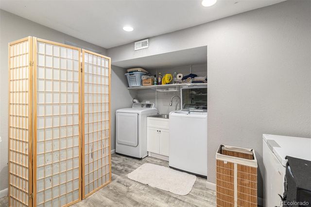 a view of storage and utility room with closet