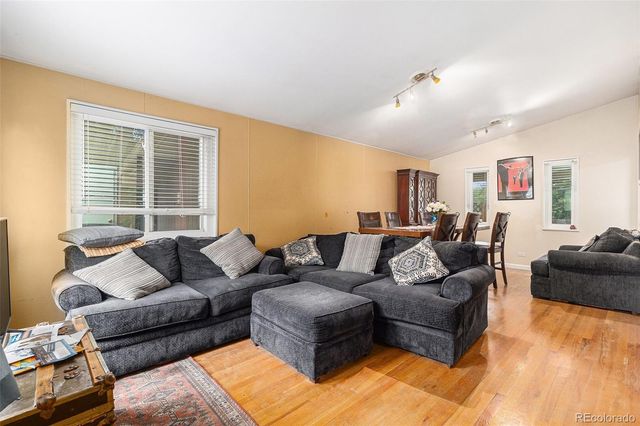 a living room with furniture window and couch