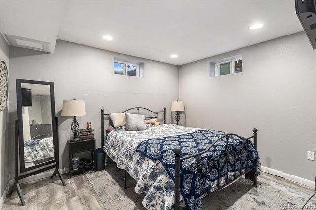 a bedroom with a bed and lamp