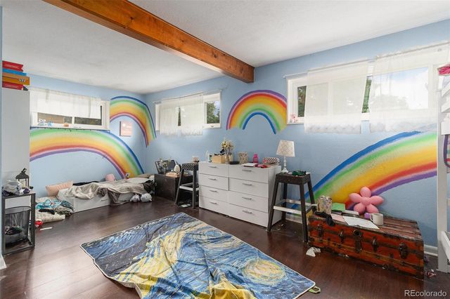 a room with toys and a wooden floor