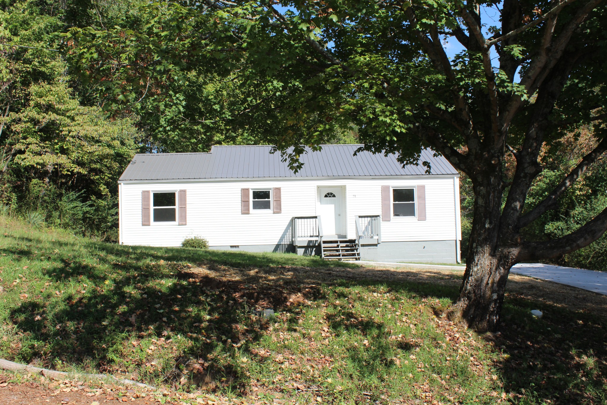 78 College Street Erin, TN 37061 - Photo 16 of 17 a house view with a backyard space