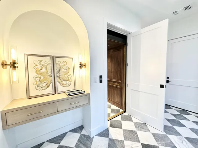 a view of a bathroom with wooden floor and a shower
