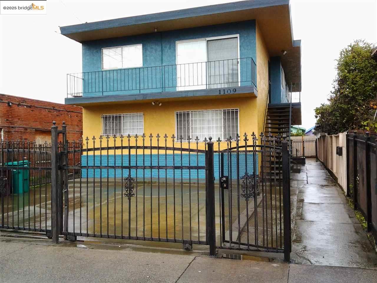 a view of a brick house with many windows