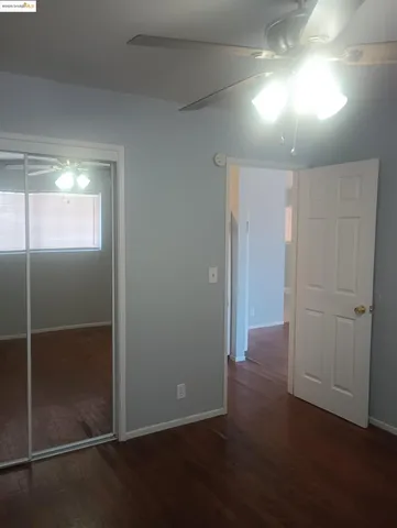 a view of hallway with an empty room