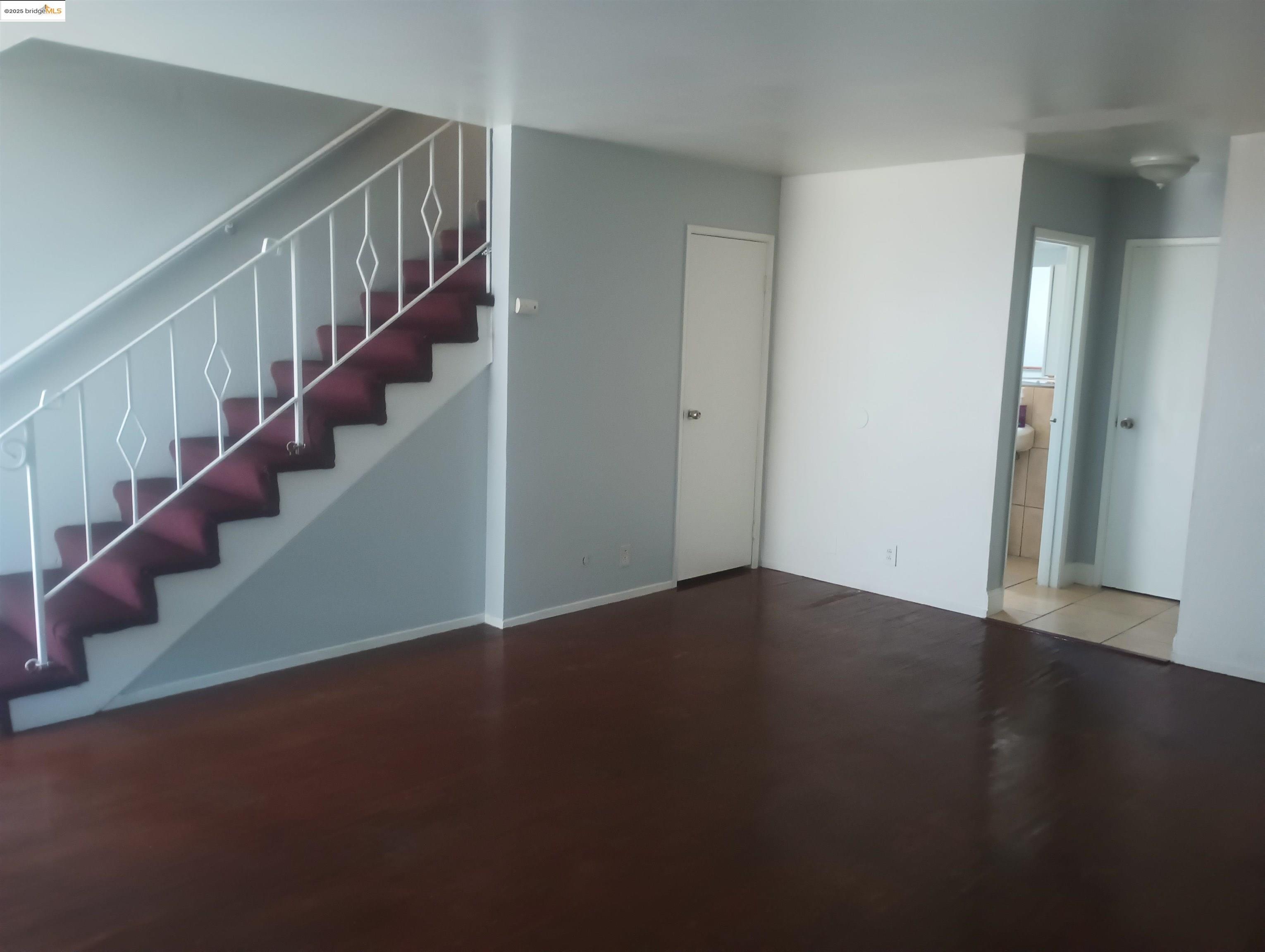 1109 Seminary Avenue Oakland, CA 94621 - Photo 2 of 51 a view of an empty room with stairs