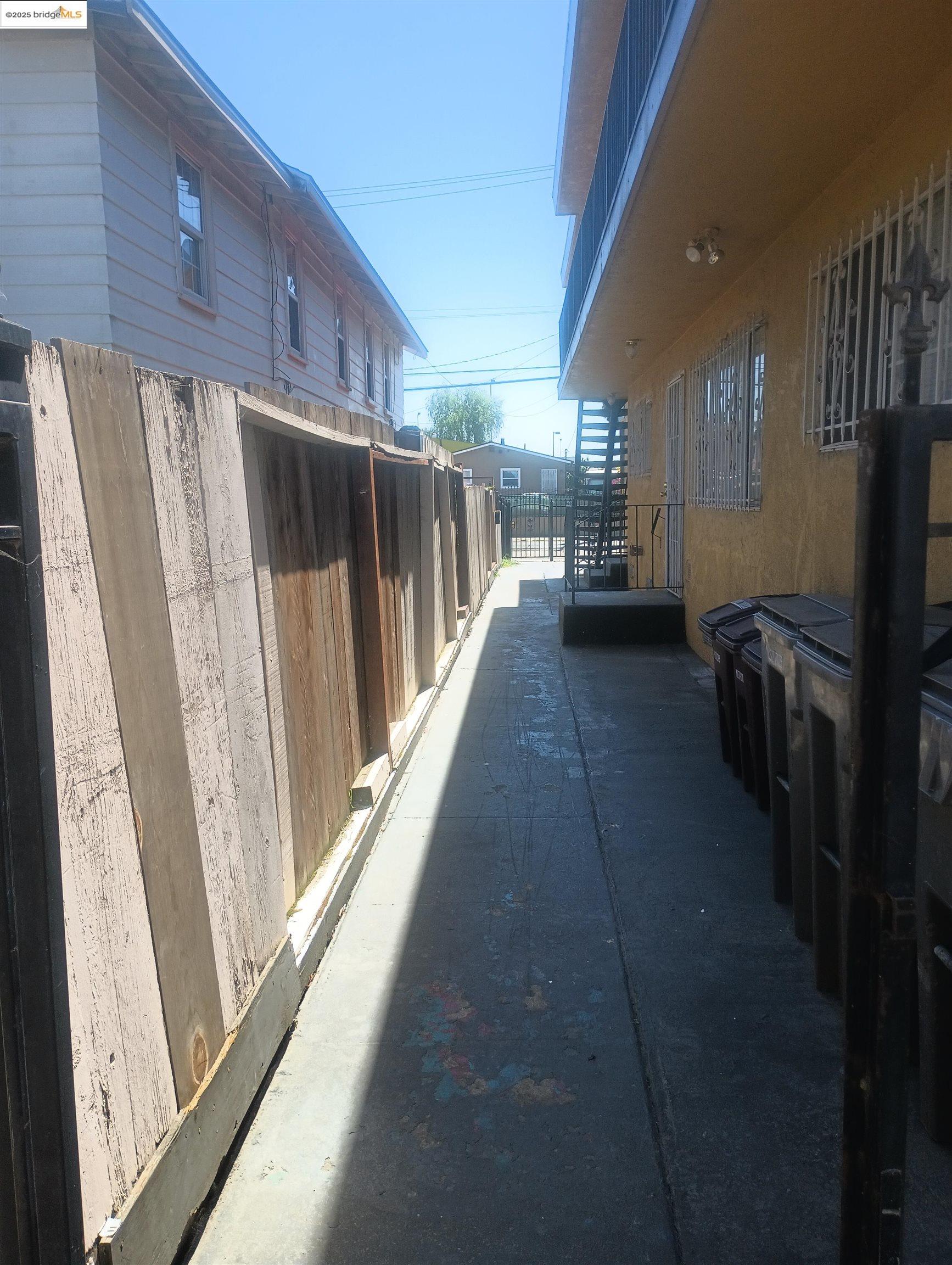 1109 Seminary Avenue Oakland, CA 94621 - Photo 23 of 51 a view of a hallway with wooden floor