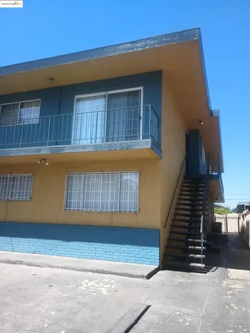 a kitchen with a sink a stove and refrigerator