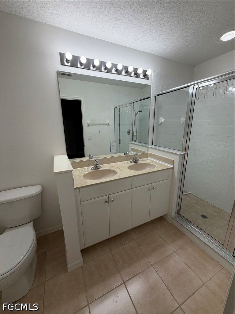 8541 Athena Court Lehigh Acres, FL 33971 - Photo 15 of 17 a bathroom with a toilet sink and mirror