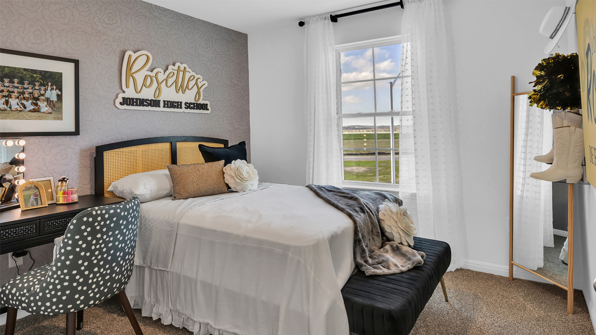 9709 Oxbow Strap Drive Austin, TX 78724 - Photo 26 of 26 a bedroom with a bed and wooden floor