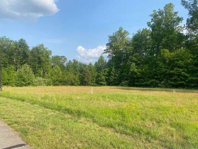 a view of open space with a lake view