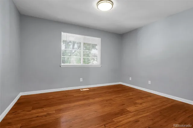 wooden floor with white walls