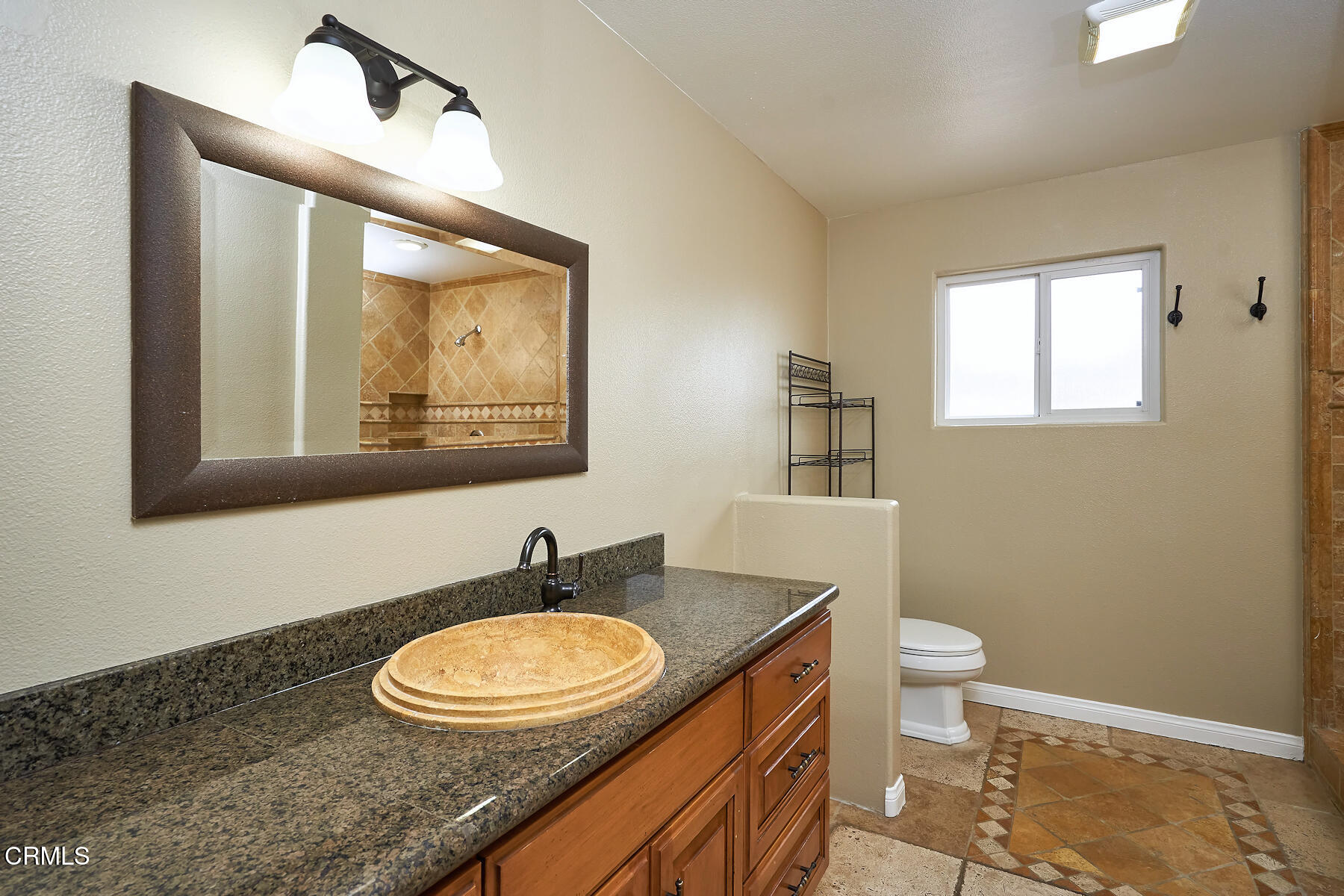 1700 Arlene Avenue Oxnard, CA 93036 - Photo 15 of 29 a bathroom with a granite countertop sink and a mirror