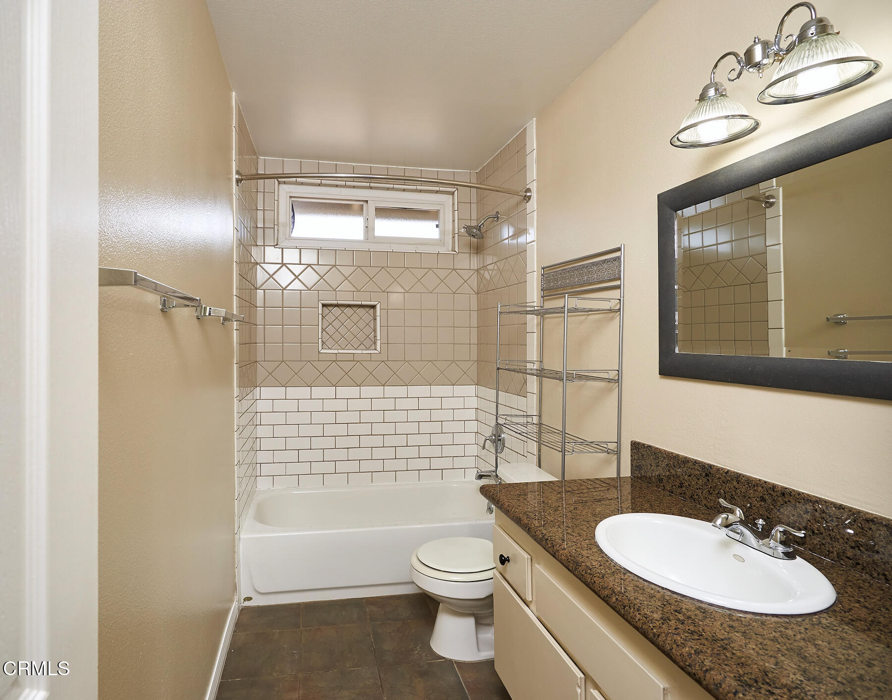 1700 Arlene Avenue Oxnard, CA 93036 - Photo 19 of 29 a bathroom with a granite countertop sink toilet a mirror and shower