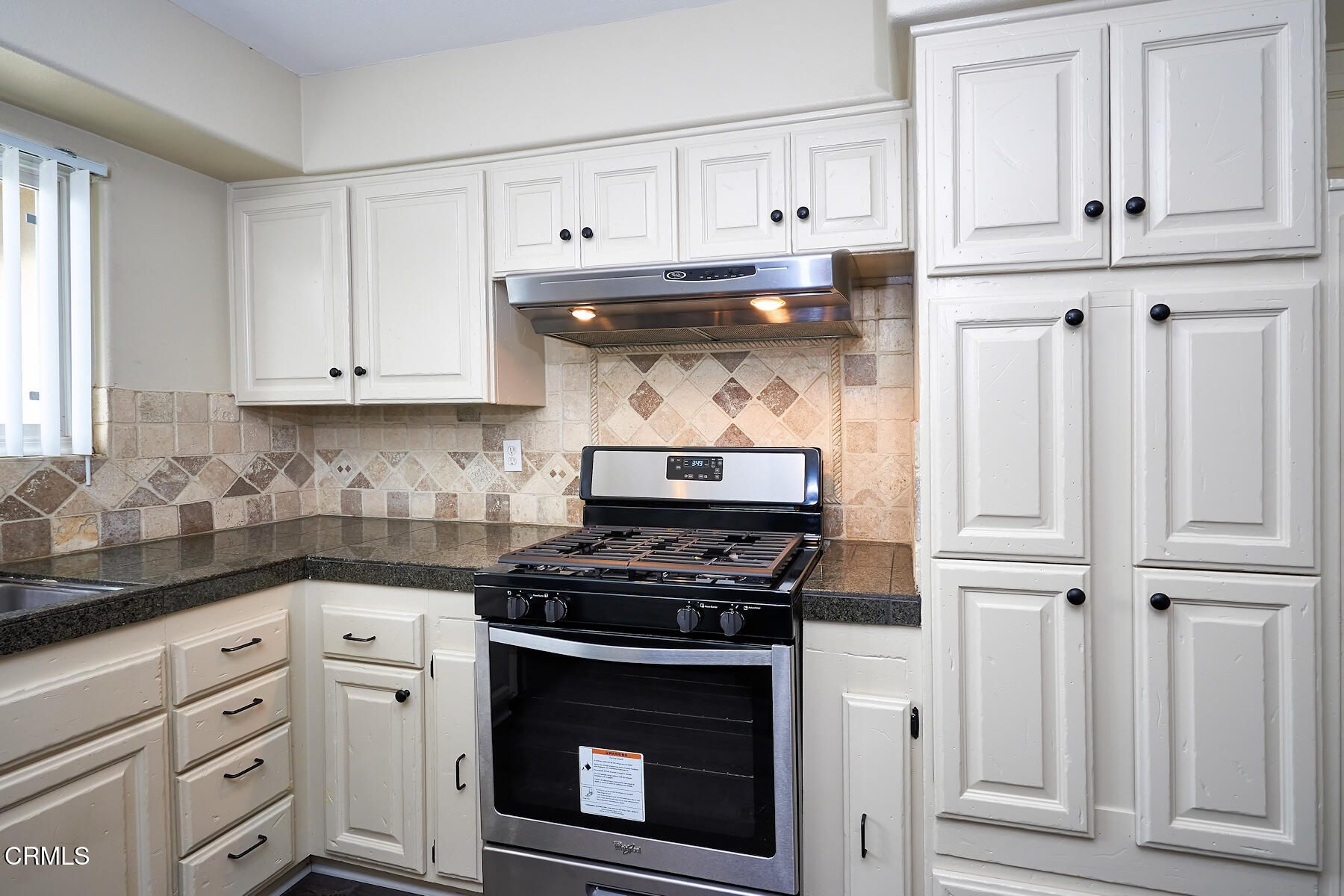 1700 Arlene Avenue Oxnard, CA 93036 - Photo 9 of 29 a kitchen with white cabinets and appliances