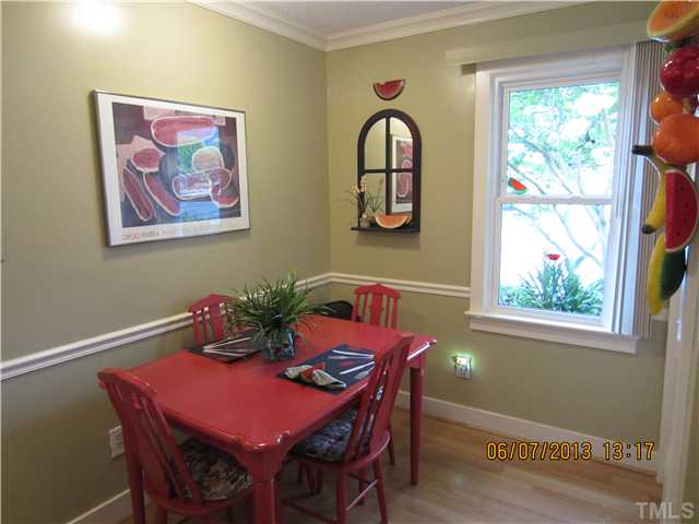 1429 Quarter Point Raleigh, NC 27615 - Photo 8 of 25 Eat in Kitchen with pergo flooring and utility closet for washer/dryer