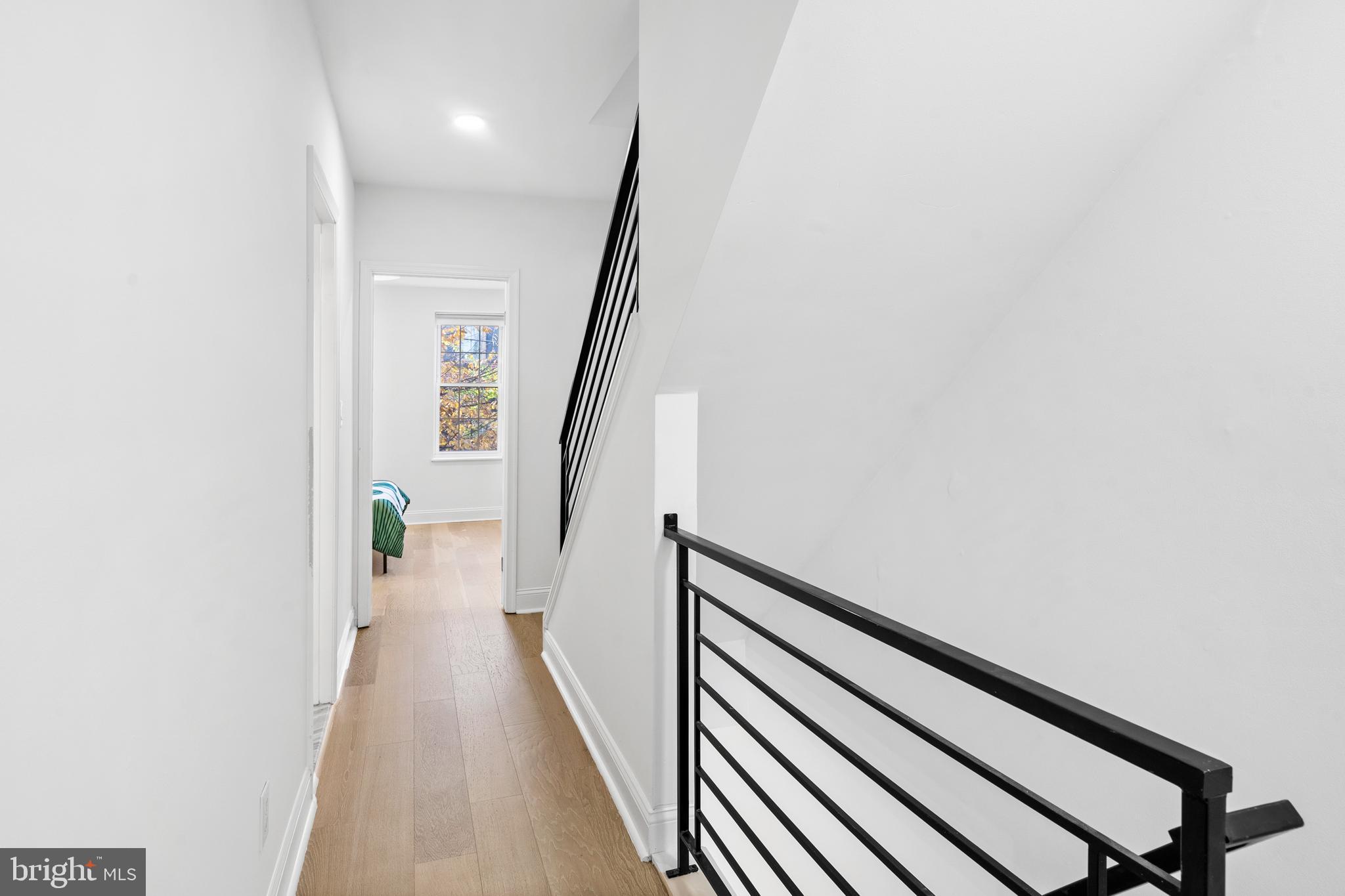 725 South 15th Street Philadelphia, PA 19146 - Photo 11 of 34 a view of a hallway with wooden floor and stairs