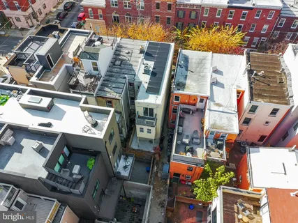 an aerial view of a building with outdoor space