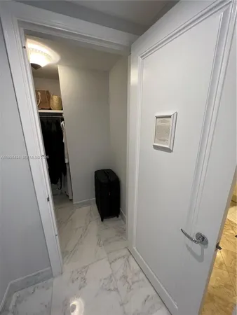 a view of a living room and a floor to ceiling window