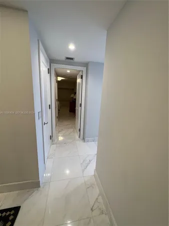 a bedroom with bed and a night stand