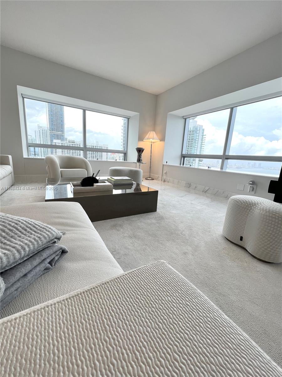 1435 Brickell Avenue, Unit 3307 Miami, FL 33131 - Photo 59 of 77 a bedroom with furniture and a large window
