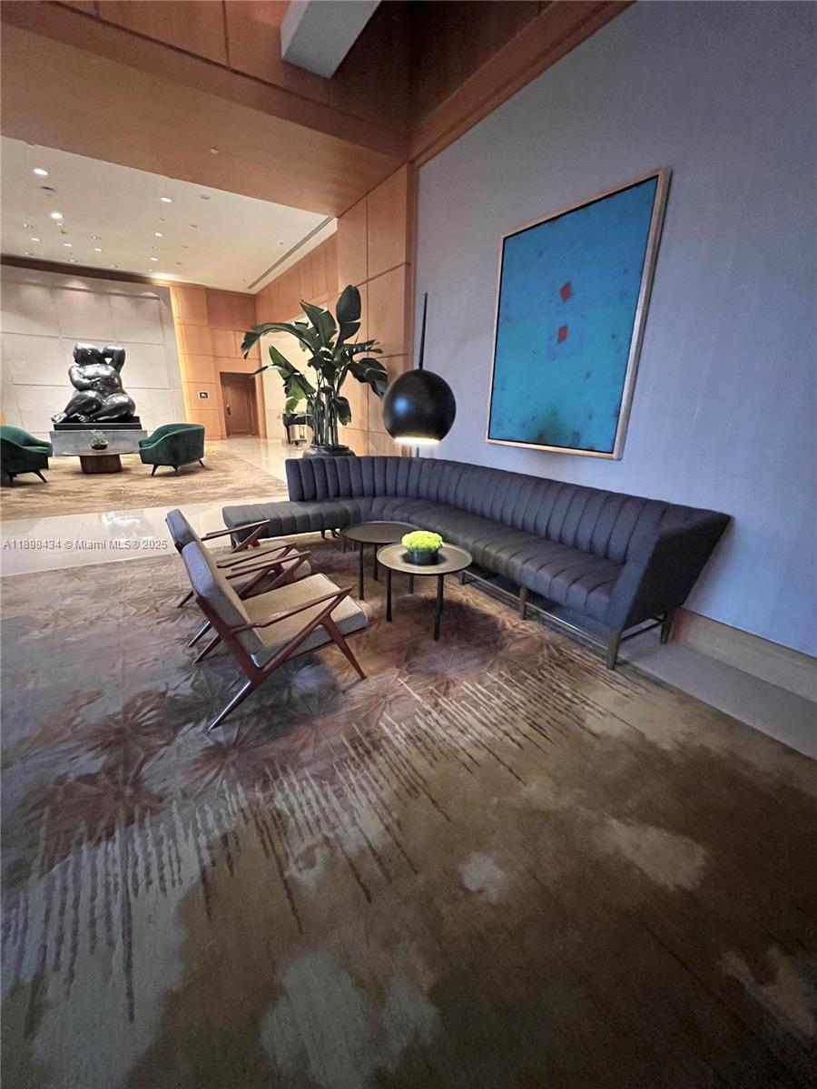 1435 Brickell Avenue, Unit 3307 Miami, FL 33131 - Photo 73 of 77 a living room with furniture and wooden floor