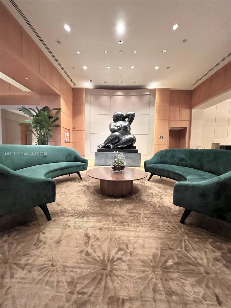 1435 Brickell Avenue, Unit 3307 Miami, FL 33131 - Photo 74 of 77 a living room with furniture and a large window