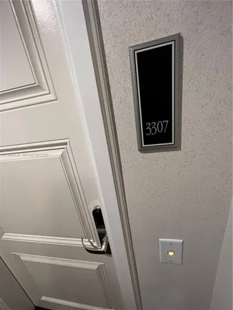 a view of a closet with wooden floor