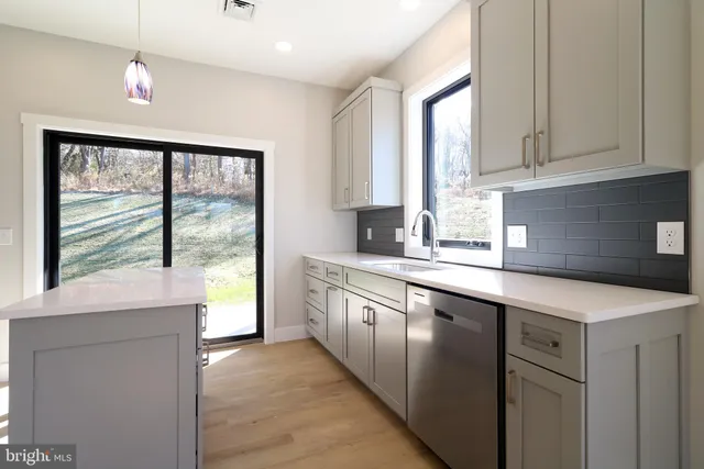 a view bathroom with granite countertop cabinets and a sink