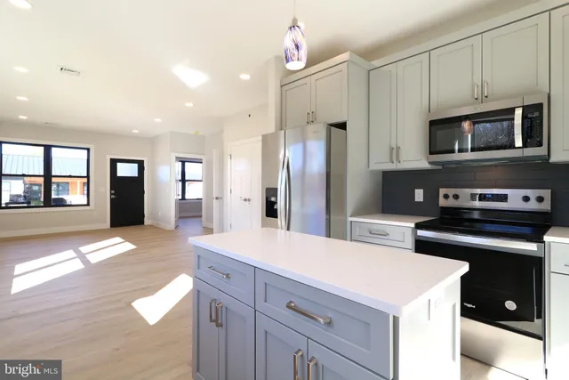 a kitchen with a stove and a microwave