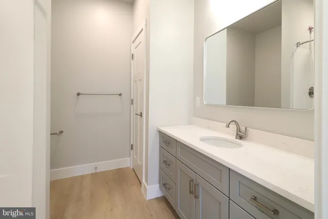 a bathroom with a granite countertop shower