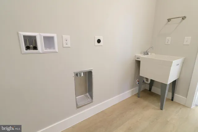 a white toilet sitting next to a bathroom sink