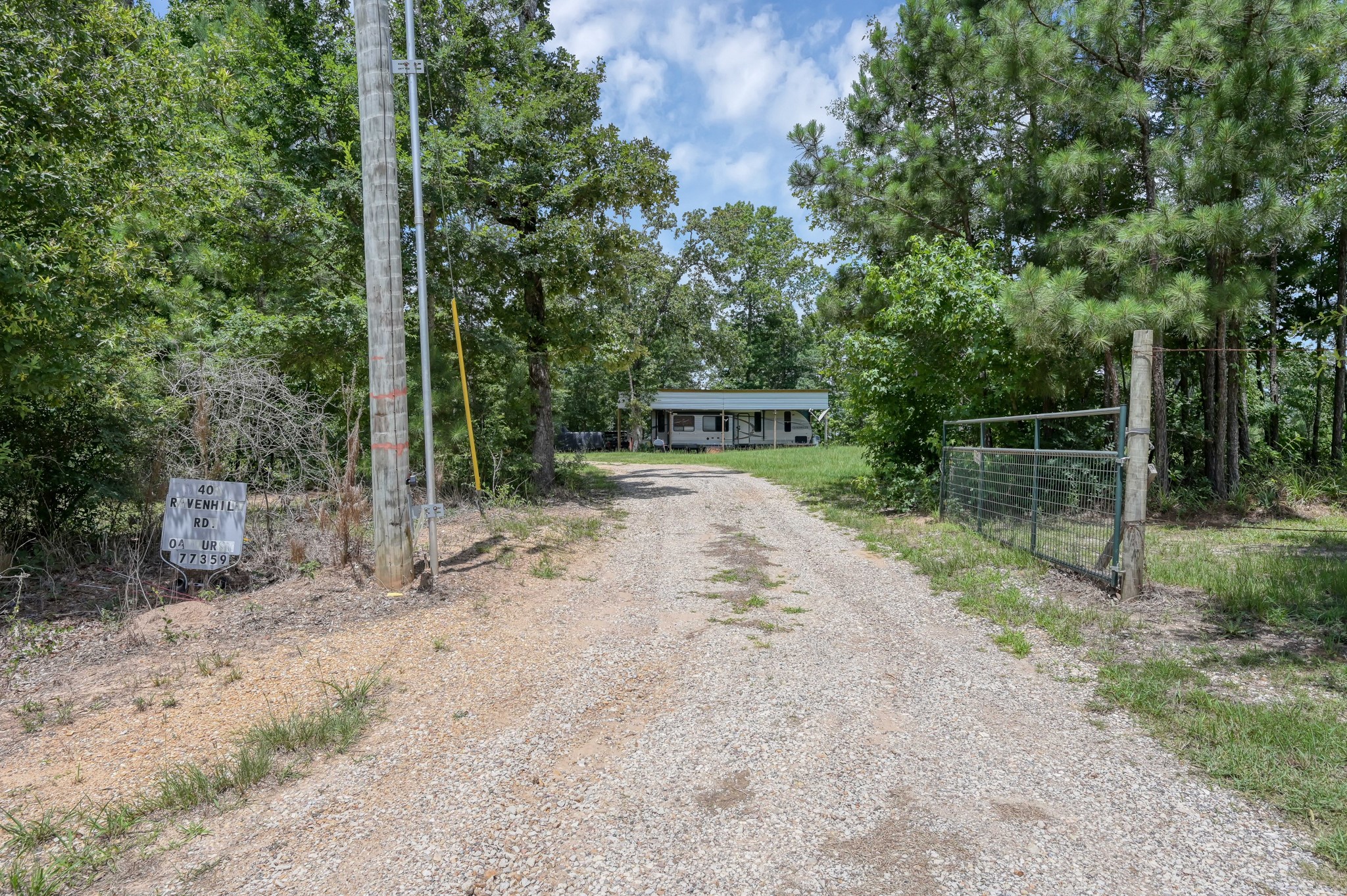 400 Raven Hill Road Oakhurst, TX 77359 - Photo 8 of 45 a view of a park with a bench and trees
