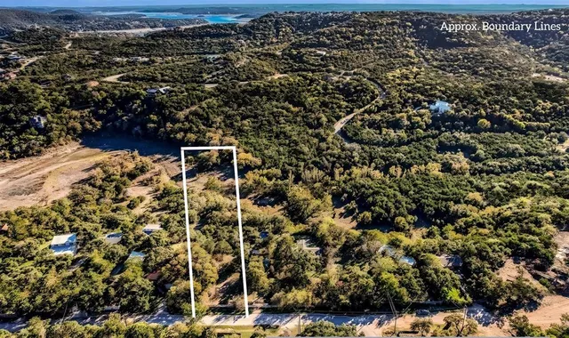 an aerial view of house with yard