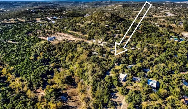 an aerial view of house with yard