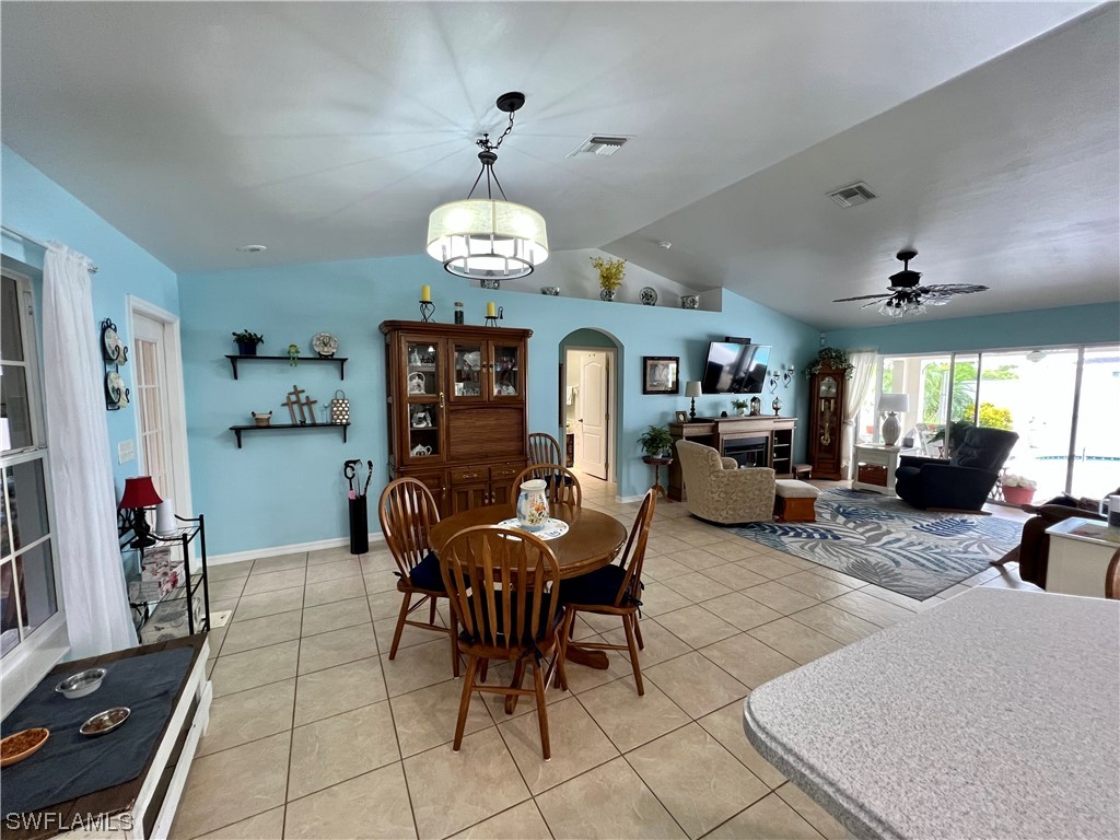 153 Patio Street Lehigh Acres, FL 33974 - Photo 19 of 27 a view of a dining room with furniture