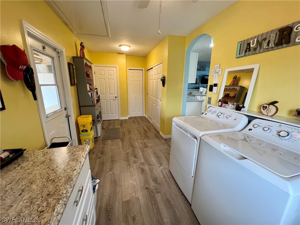153 Patio Street Lehigh Acres, FL 33974 - Photo 21 of 27 a utility room with dryer and washer