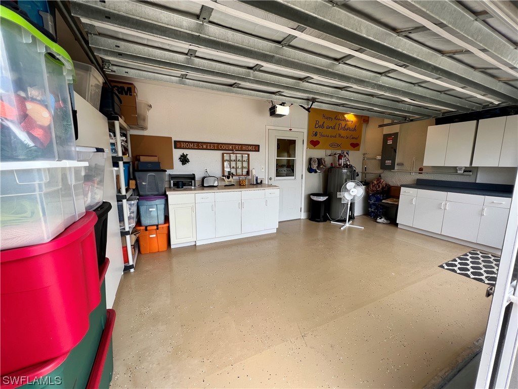 153 Patio Street Lehigh Acres, FL 33974 - Photo 26 of 27 a view of storage and utility room